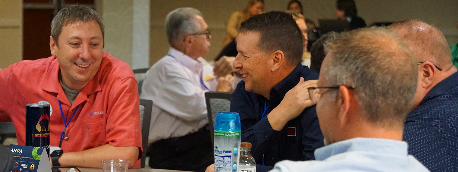 A photo of on the road attendees chatting during an open session