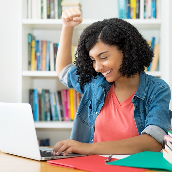 A photo of a student winning a scholarship