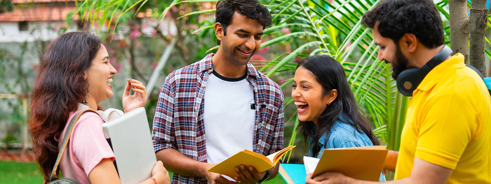 A photo of college students laughing on the quad