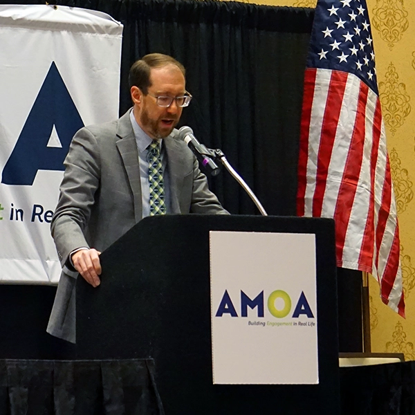 A photo of Brian Brotch speaking at the member breakfast