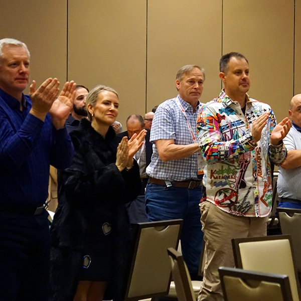 a photo of applause at the member breakfast